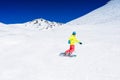 Girl snowboarder having fun in the winter ski resort.