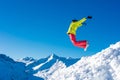 Girl snowboarder jumping and having fun in the winter ski resort. Royalty Free Stock Photo