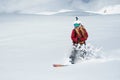 Girl snowboarder rides fast on snow Freeride