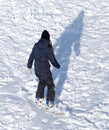 Girl snowboarding in the snow in winter