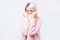 A girl with a social phobia hides her face in a sweater Royalty Free Stock Photo