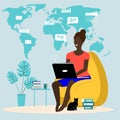 Black girl woman works in a chair on the computer. Home office freelance work anywhere.