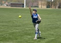 Girl softball pitcher warming up before a game