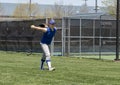 Girl softball pitcher warming up before a game