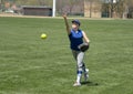 Girl softball pitcher warming up before a game