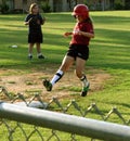 Girl Softball player reaches third base