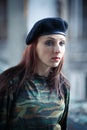 Girl soldier in uniform. The girl in the black beret. Camouflage t-shirt on the girl Royalty Free Stock Photo