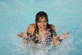 Girl splashing in water