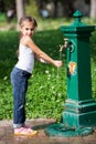 Girl splashing water at the park