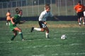 A girl`splaying in a girls soccer game Royalty Free Stock Photo