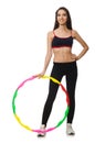 A girl in sport suit with hula hoop isolated on