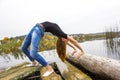 Girl with sports figure on background of calm autumn river. Yoga, Meditation, Relax Royalty Free Stock Photo