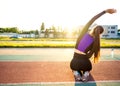 Girl sportsman crossfit and run at sunset in the stadium