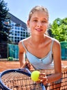 Girl sportsman with racket and ball on tennis Royalty Free Stock Photo