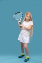 Girl in sportswear swings tennis racket on right Royalty Free Stock Photo