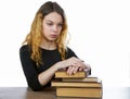 Girl with a stack of books isolated on a white