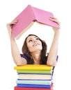 Girl with stack color book .