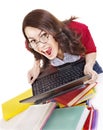 Girl with stack color book and laptop.