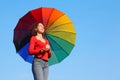 Girl is standing against sky, holding parasol Royalty Free Stock Photo