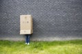 Girl standing against a wall