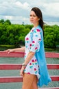 A girl standing on a balcony above the river Royalty Free Stock Photo