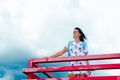 A girl standing on a balcony above the river Royalty Free Stock Photo