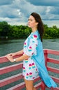 A girl standing on a balcony above the river Royalty Free Stock Photo