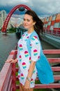 A girl standing on a balcony above the river Royalty Free Stock Photo