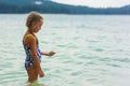 Girl standing on the beach and looks into the distance Royalty Free Stock Photo