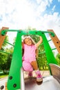 Girl standing with bending knees on the chute Royalty Free Stock Photo