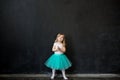 Girl standing in front of chalk board Royalty Free Stock Photo