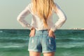 Girl standing in front of the ocean Royalty Free Stock Photo