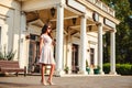 Girl standing in front of the old train station Royalty Free Stock Photo