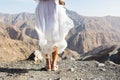 Girl standing on the mountain top edge Royalty Free Stock Photo