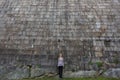Girl standing near the a huge stone wall. Porto. Royalty Free Stock Photo
