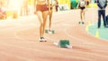 Girl standing near starting blocks before sprint Royalty Free Stock Photo