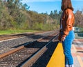 Girl Standing Near Train Rails