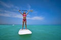 Girl standing on paddle surf board SUP Royalty Free Stock Photo