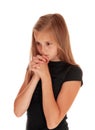 Girl standing in profile and praying. Royalty Free Stock Photo