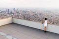 Girl standing on the roof and looking at foggy Istanbul Royalty Free Stock Photo