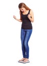 Girl standing on scale weight is happy Royalty Free Stock Photo