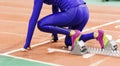 Girl standing at the starting blocks before sprint Royalty Free Stock Photo