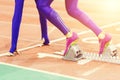 Girl standing at the starting blocks before sprint Royalty Free Stock Photo