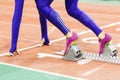 Girl standing at the starting blocks before sprint Royalty Free Stock Photo