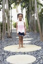 Girl Standing On Stepping Stone Royalty Free Stock Photo
