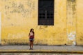 Girl standing on a street wall in Valladolid, Mexico Royalty Free Stock Photo