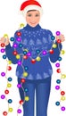 Girl standing in sweater holding garland