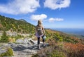 Girl standing on top of the autumn mountain. Royalty Free Stock Photo