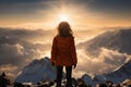 a girl is standing on top of mountain and enjoying beautiful scenery, view of mountains and valley at sunset