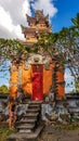 Lombok - A girl standing under the temple